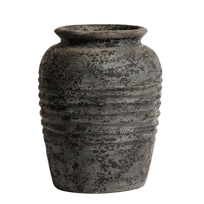 Textured black ceramic vase on a white background