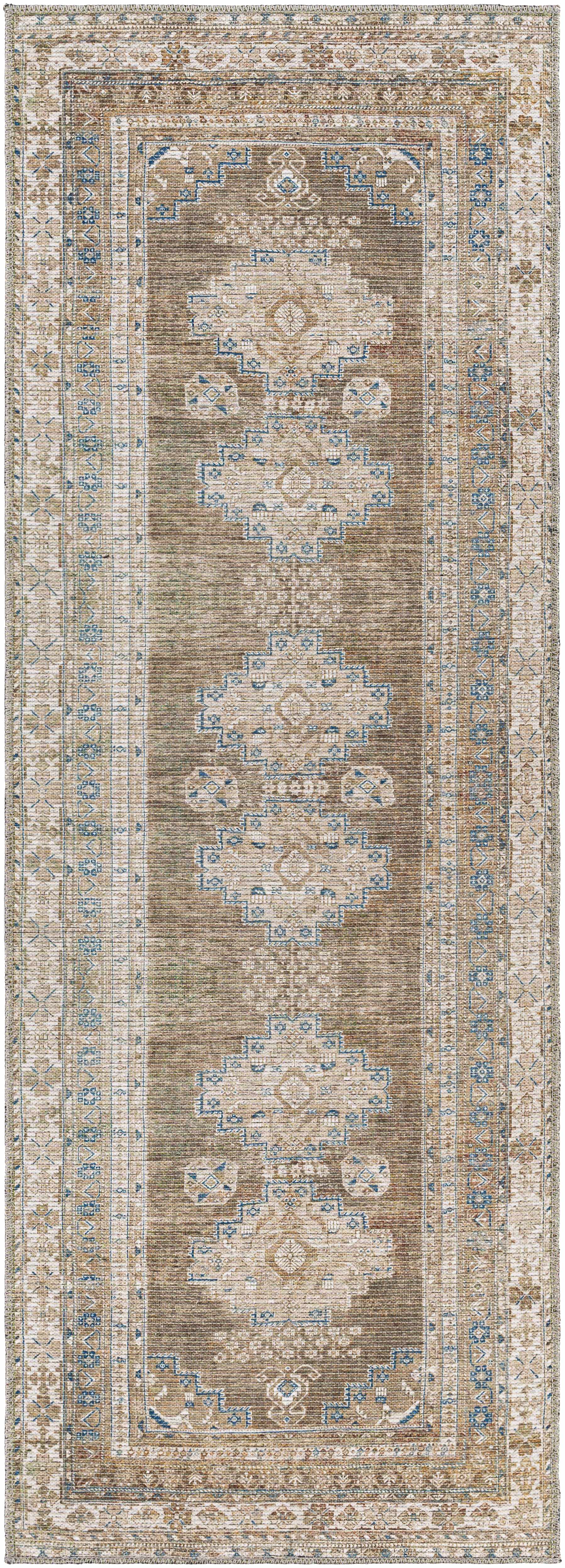 Decorative rug with intricate patterns in beige, brown, and blue on a plain background