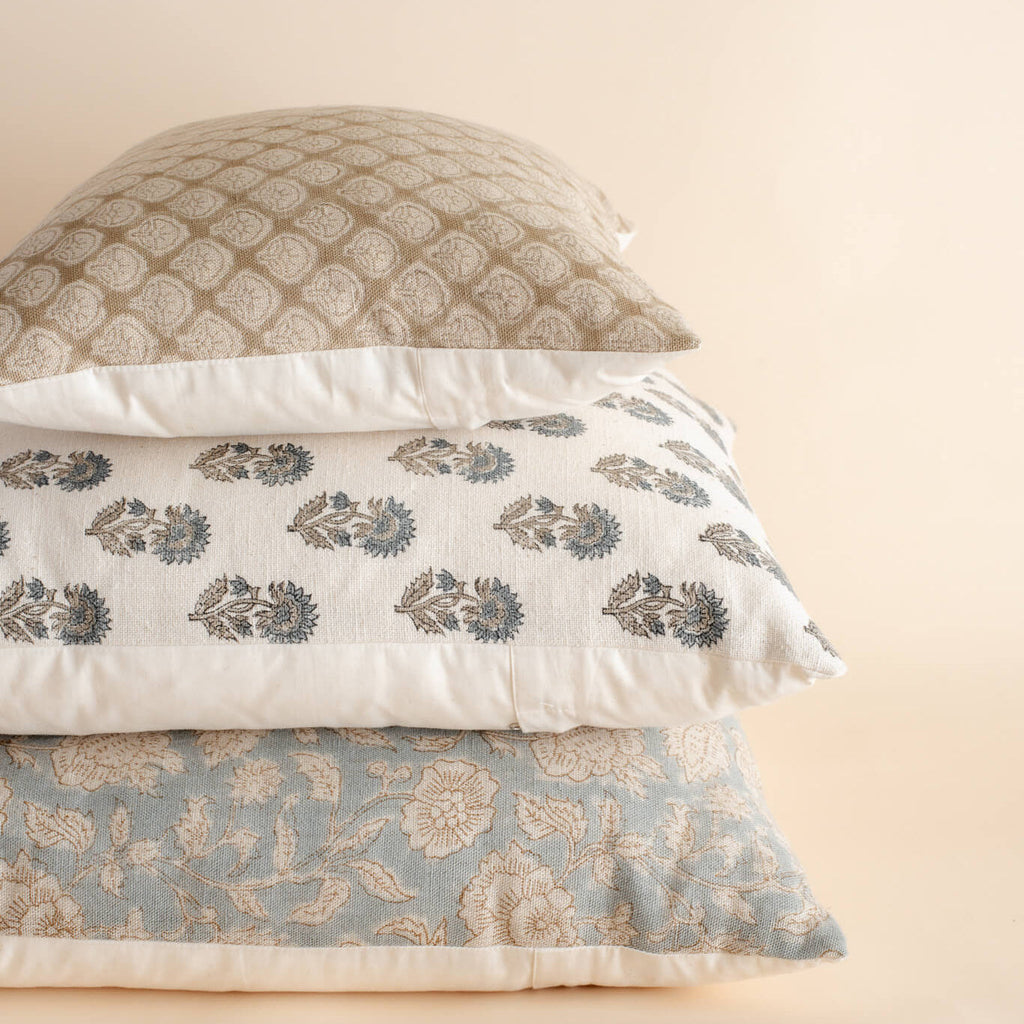 Stack of neutral patterned pillows 