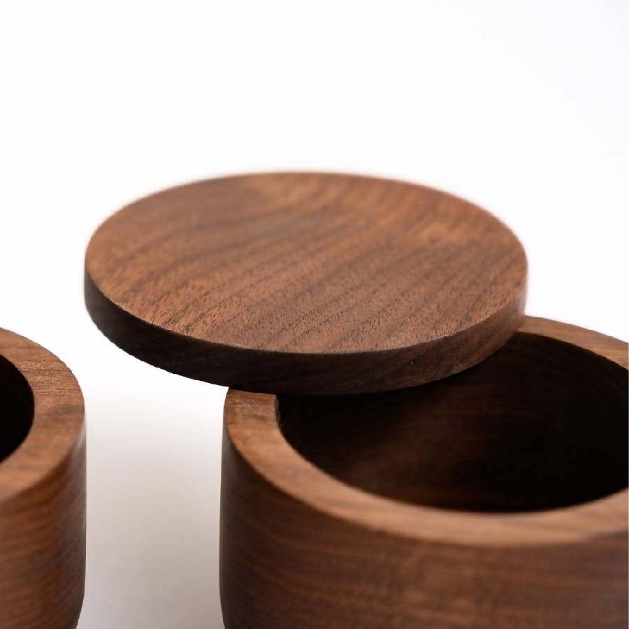 Handcrafted solid walnut wood spice jar with matching lid, artisan-made for storing sea salt, spices, herbs, sugar, or seasonings in a modern organic kitchen.