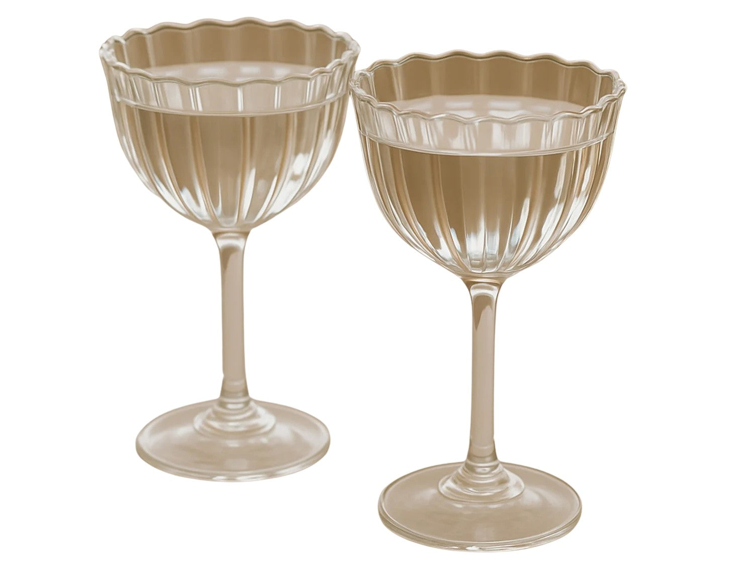 Two beige cocktail glasses with scalloped edges on a white background