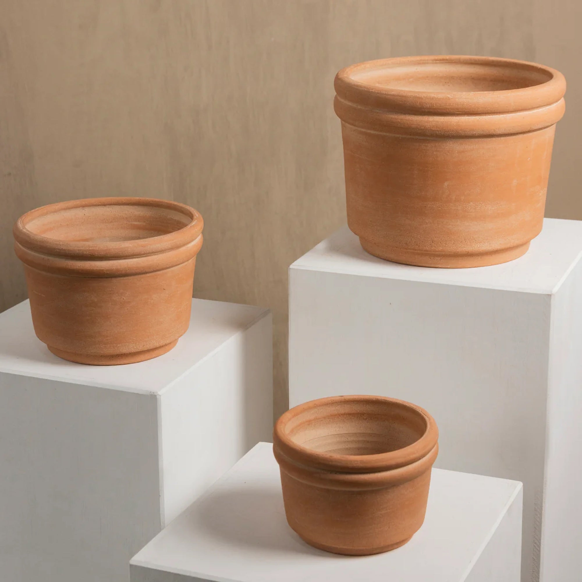 Handmade terracotta planter crafted by artisans in Honduras with a warm natural clay finish, ideal for indoor plants, herbs, succulents, and modern organic home décor.