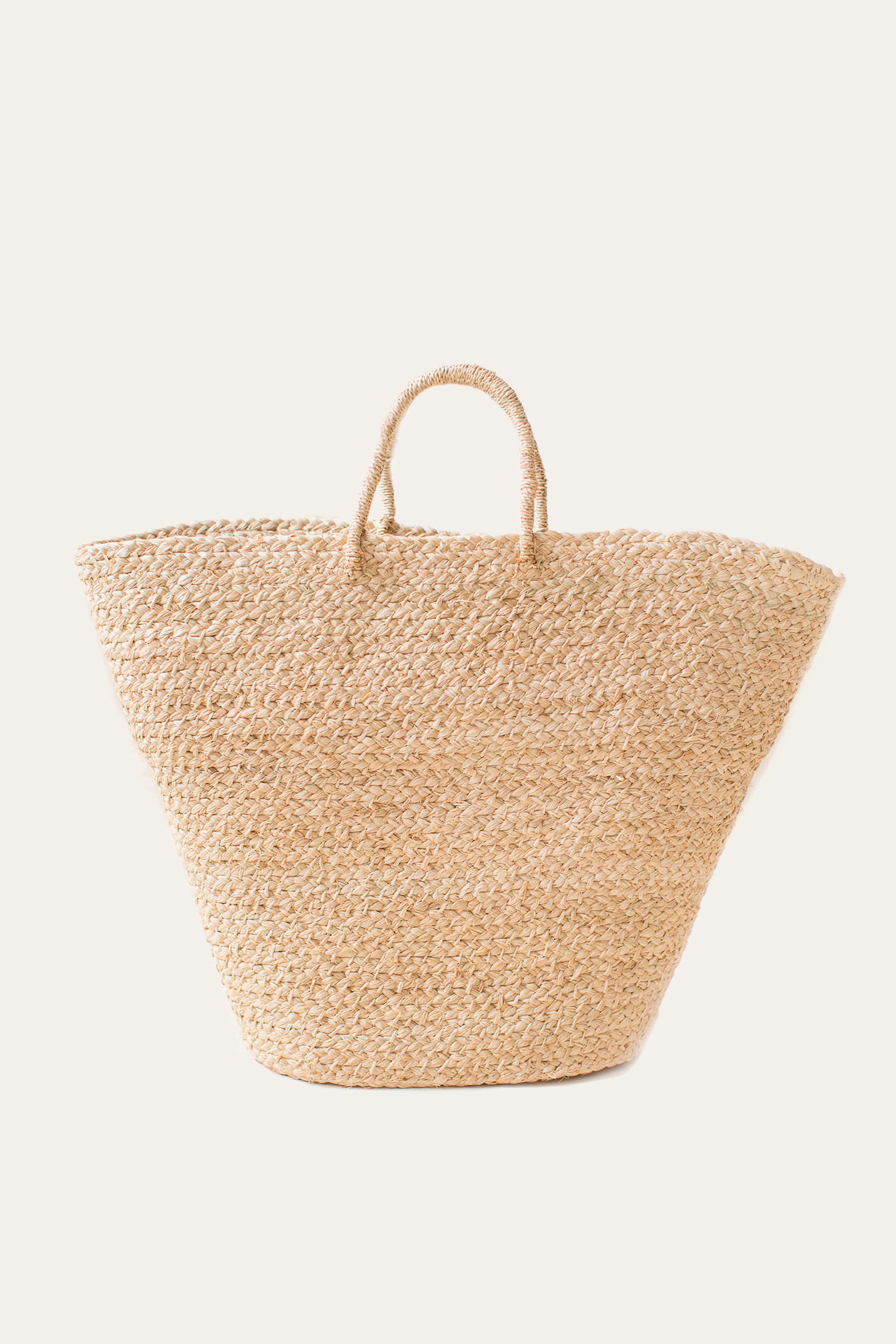 Woven straw bag on a white background