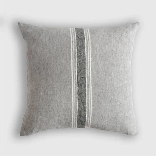 Gray pillow with a striped pattern on a white background