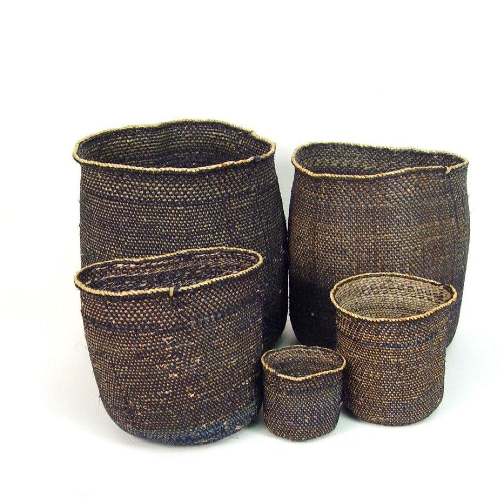 Set of woven brown baskets of various sizes on a white background