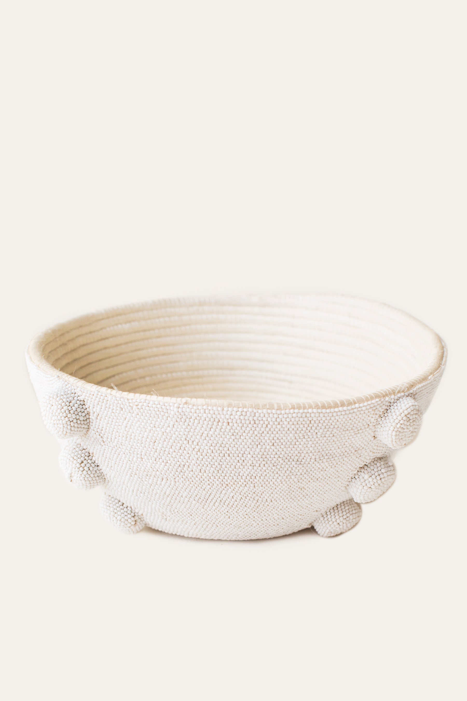 Textured woven basket on a white background