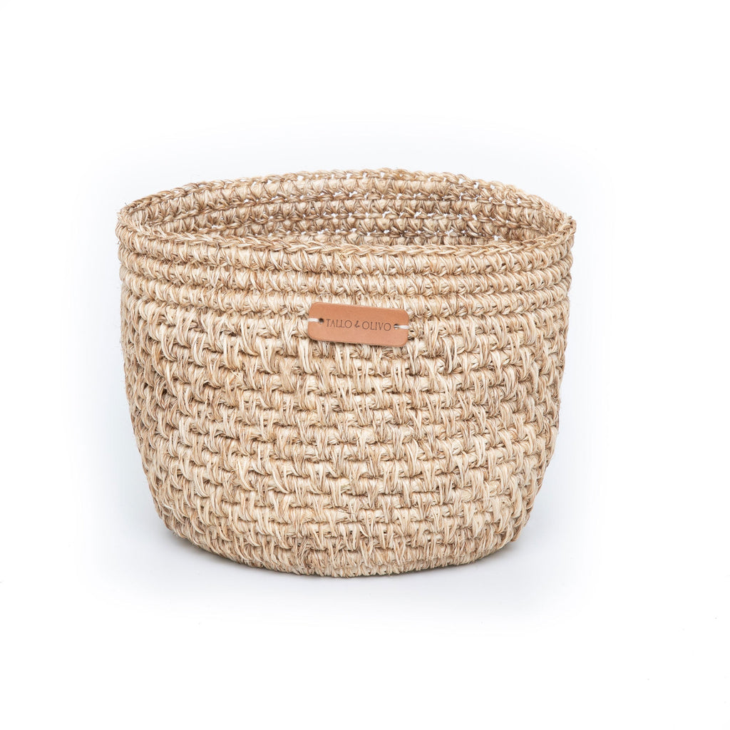Handwoven natural bread basket made by artisans with woven natural fibers. Decorative serving basket for bread, pastries, fruit, countertop storage, and farmhouse or modern organic kitchen décor.
