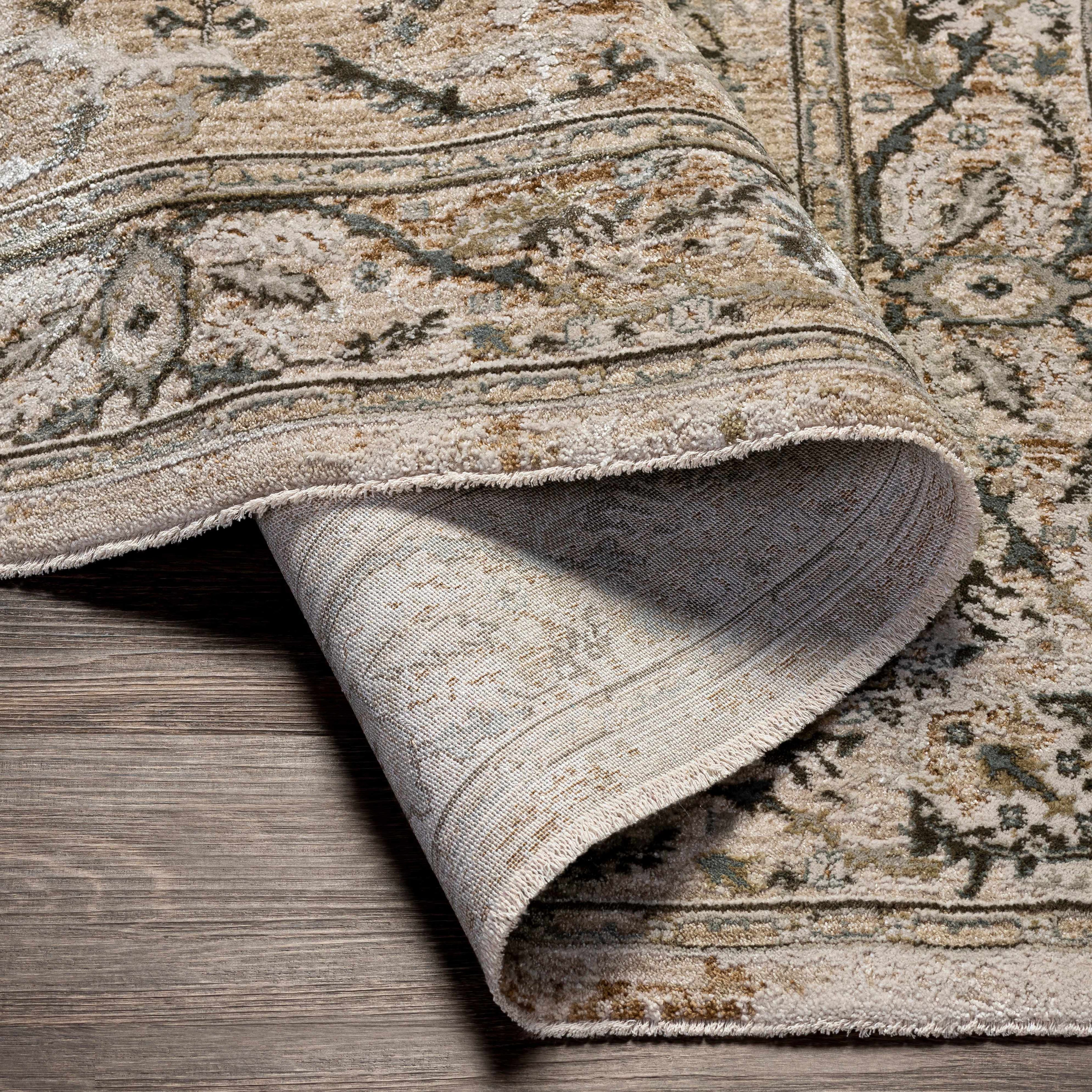 Close-up of a patterned rug on a wooden floor