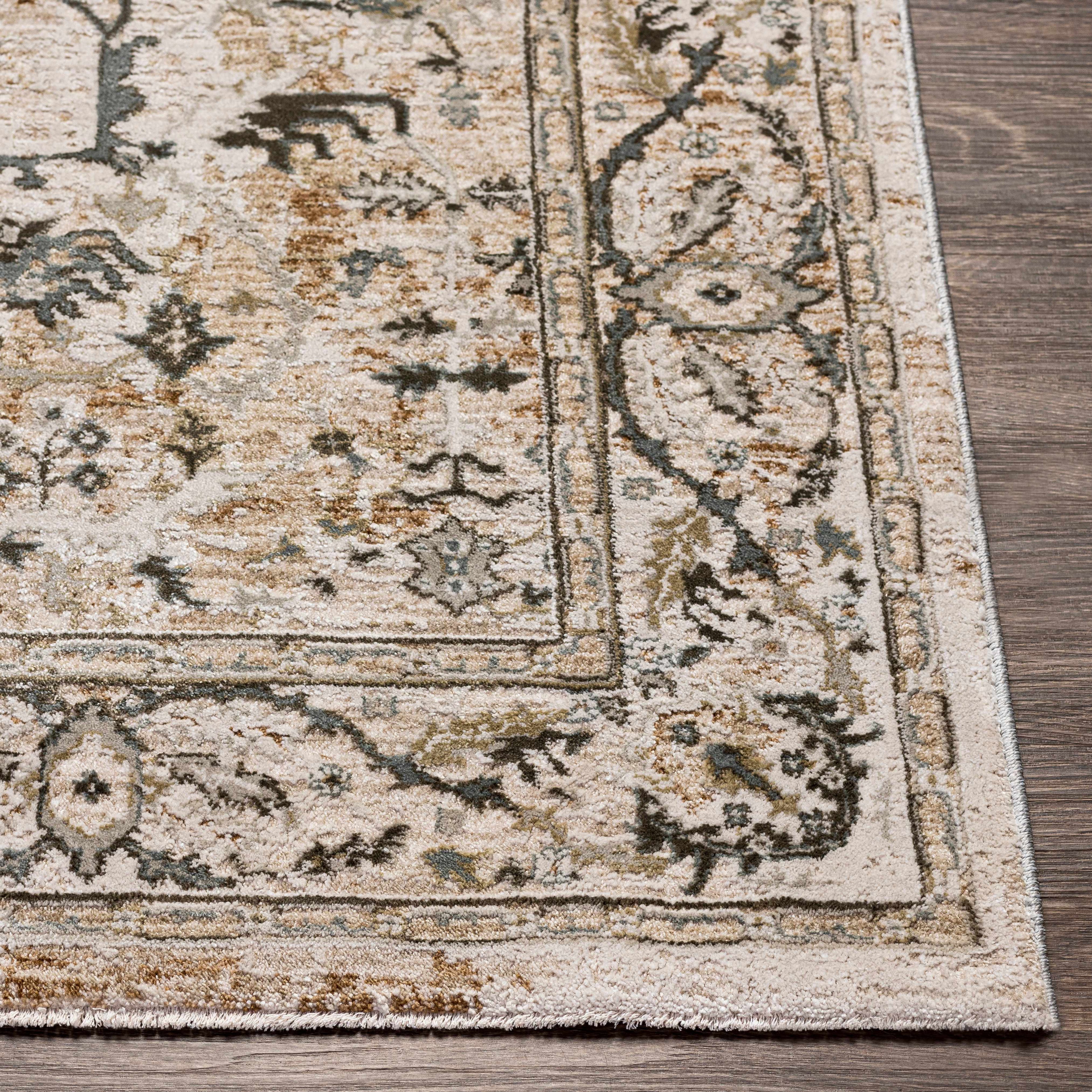 Close-up of a patterned rug on a wooden floor