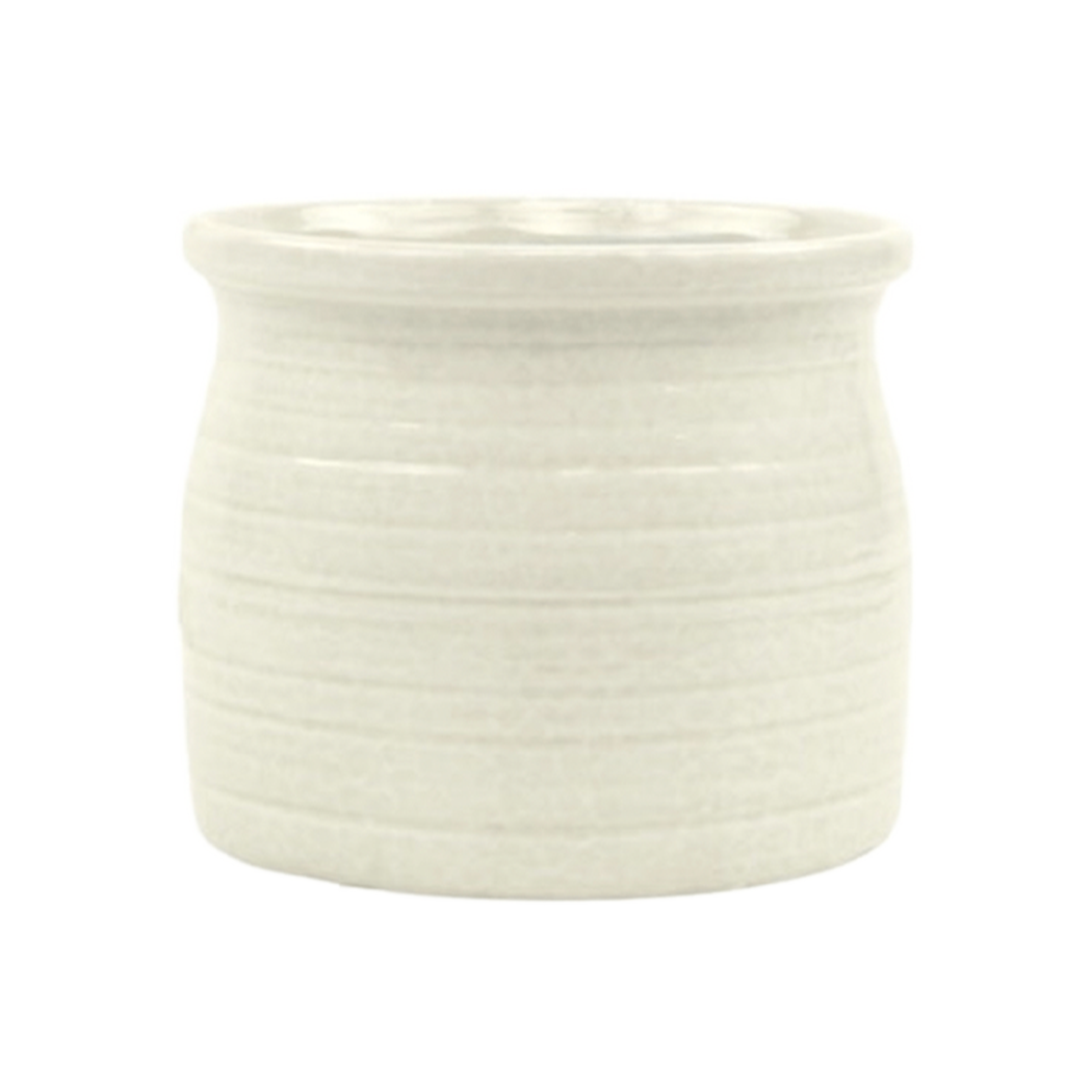 White ceramic pot with textured surface on a white background