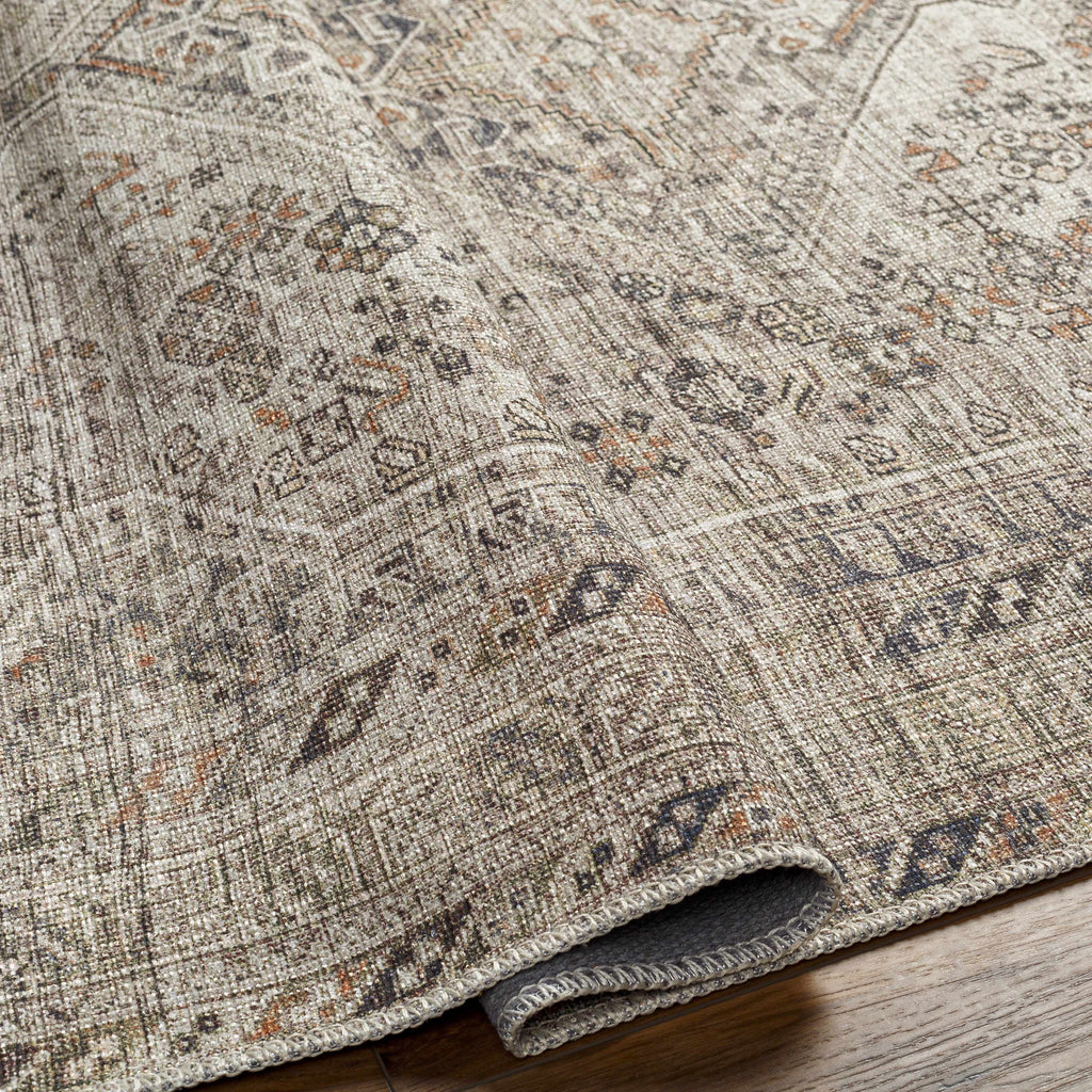 Close-up of a patterned rug on a wooden floor