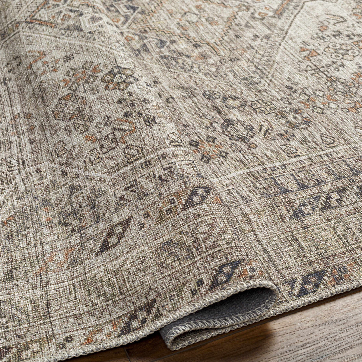 Close-up of a patterned rug on a wooden floor