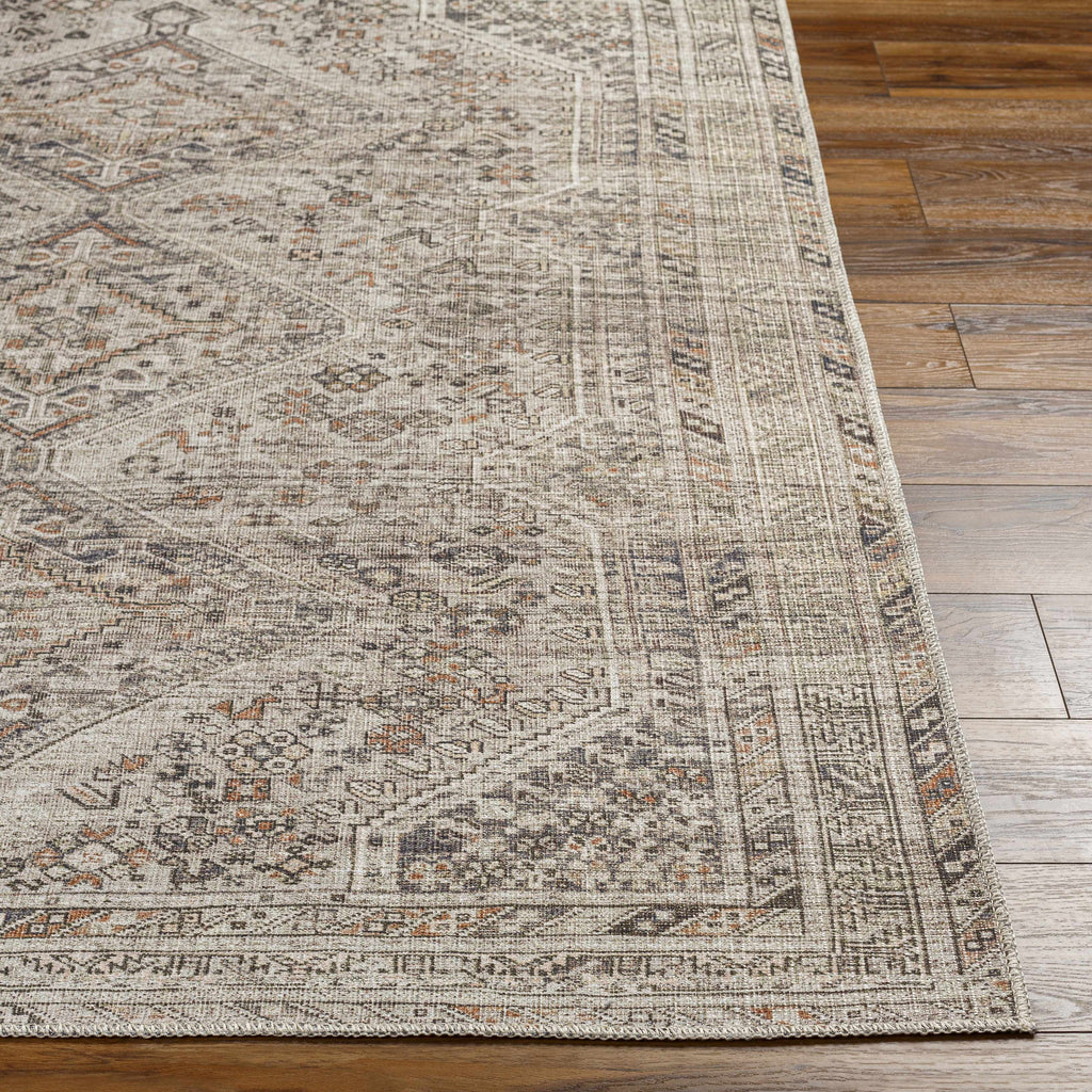 Patterned rug on a wooden floor