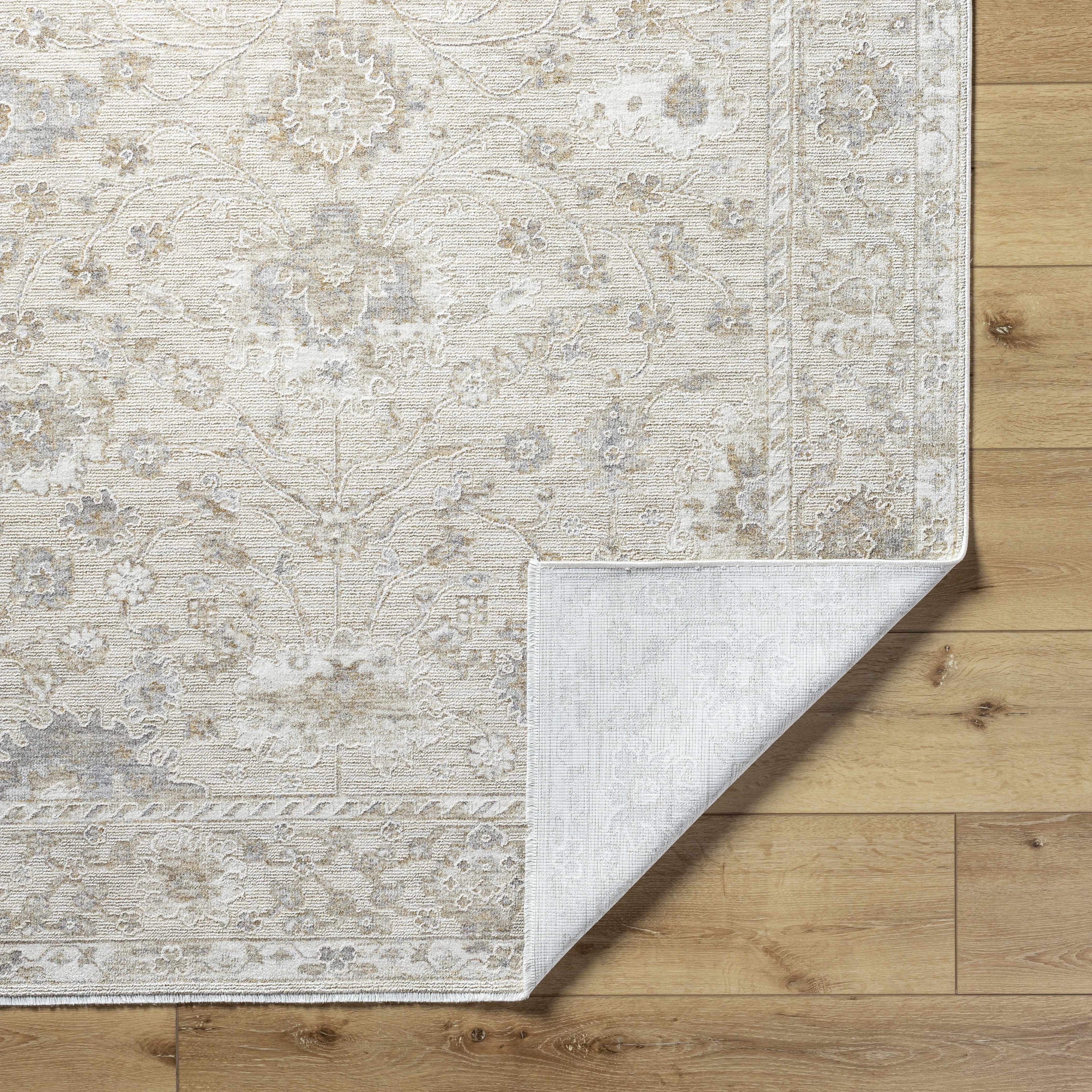 Patterned rug on a wooden floor