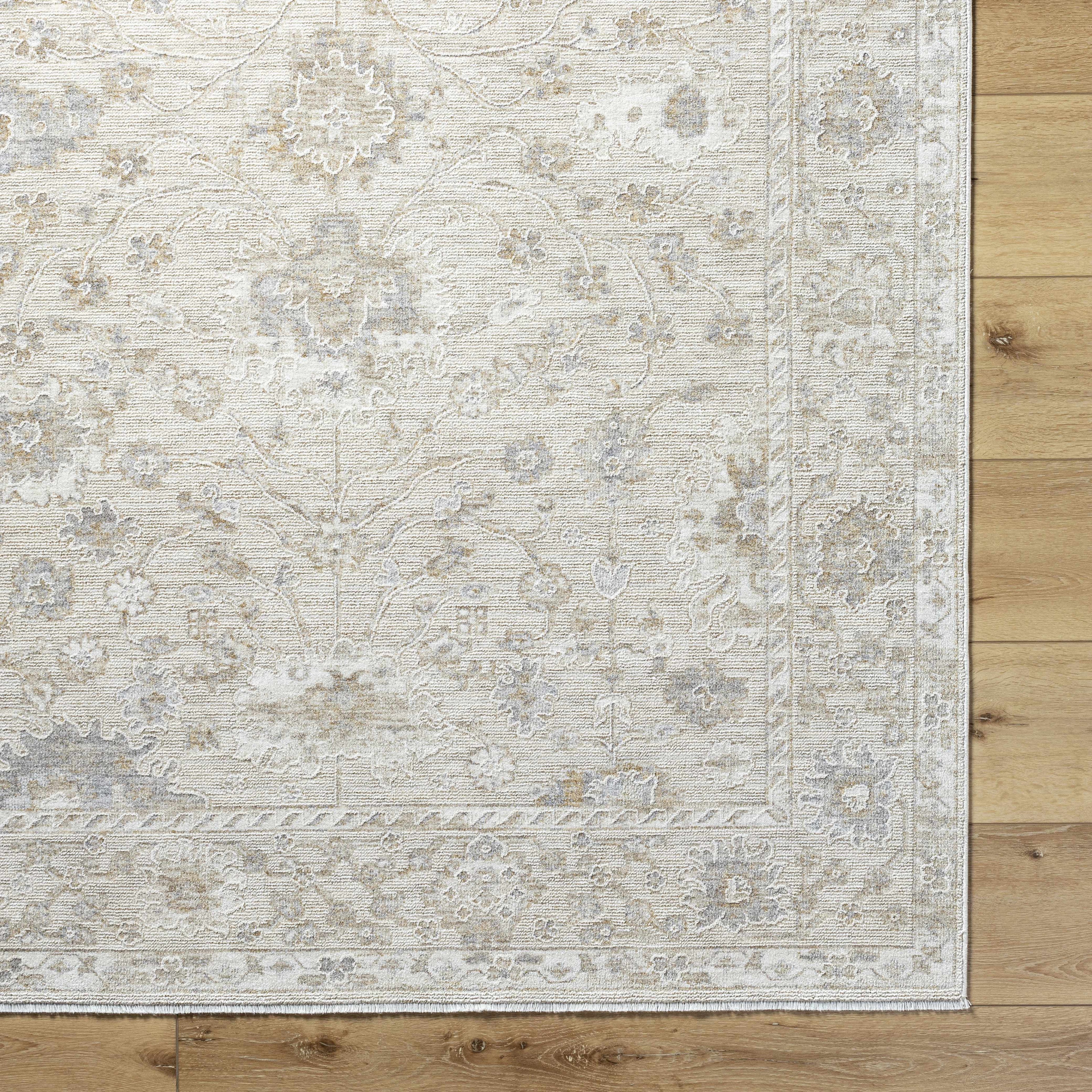 Patterned rug on a wooden floor