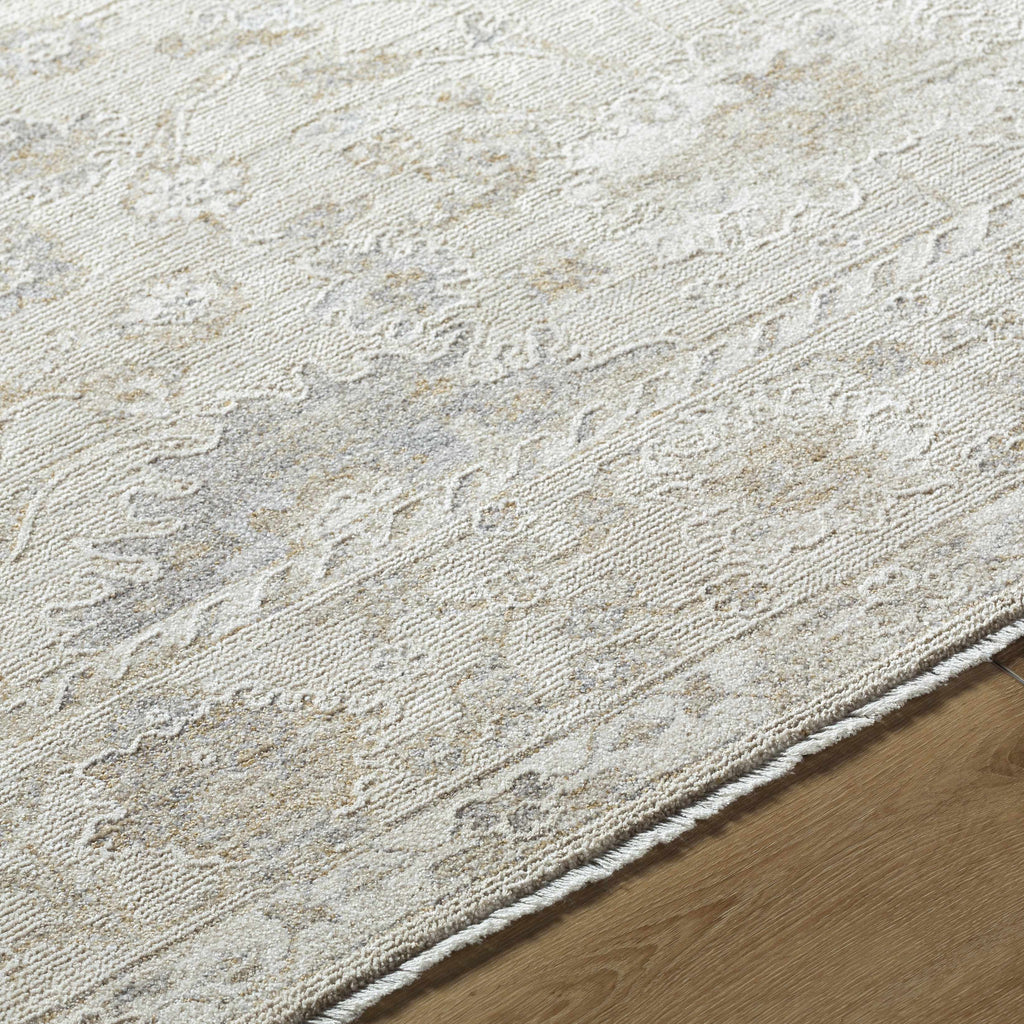 Close-up of a textured beige rug on a wooden floor