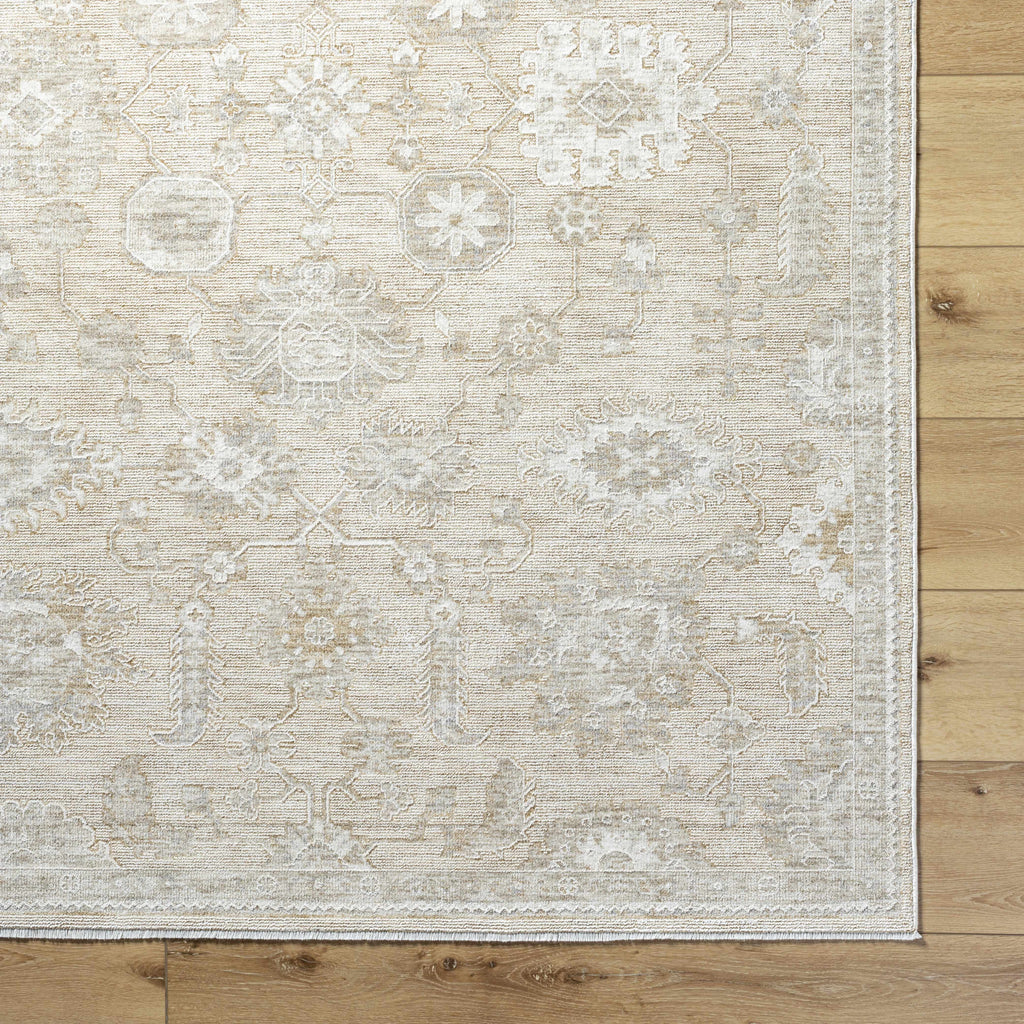 Beige patterned rug on a wooden floor