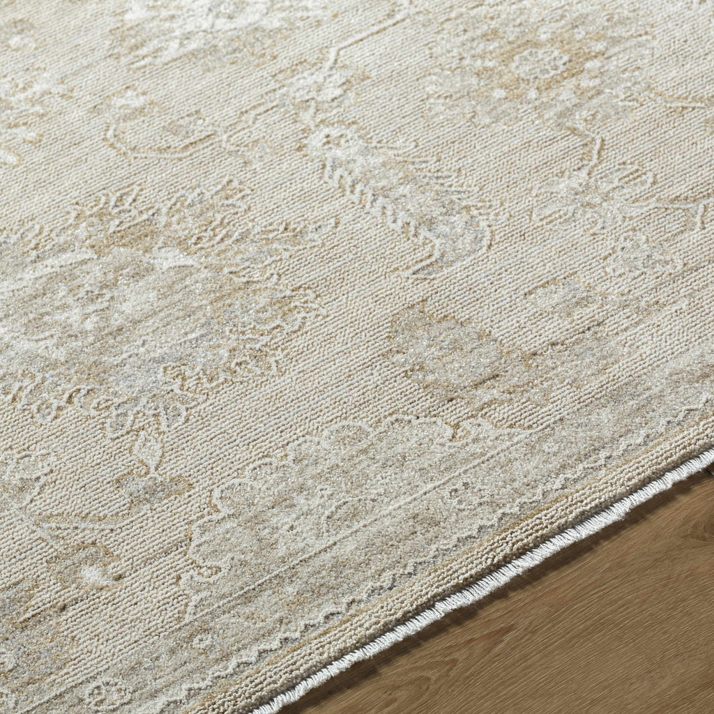 Close-up of a textured beige rug on a wooden floor